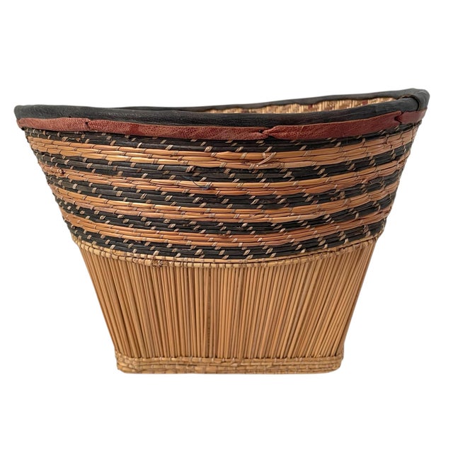 This vintage African Mossi handwoven basket is a large, round decorative piece that measures 12x13” inches wide. Made of...