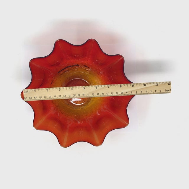 Add a vibrant pop of color to your collection with this stunning Amberina crackle glass bowl. Featuring a dramatic two-...