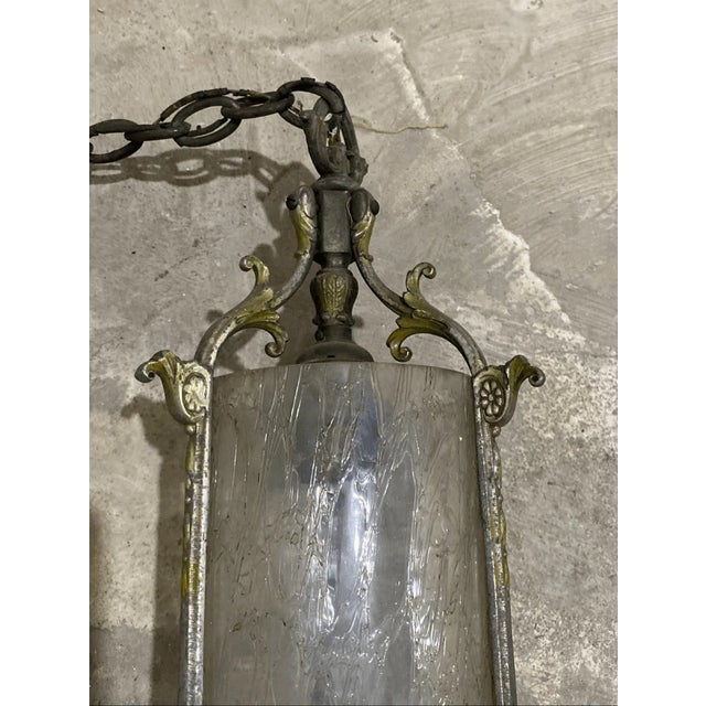 Good condition Bring a touch of historic charm to your home with this striking vintage hanging lantern. Featuring a heavy,...