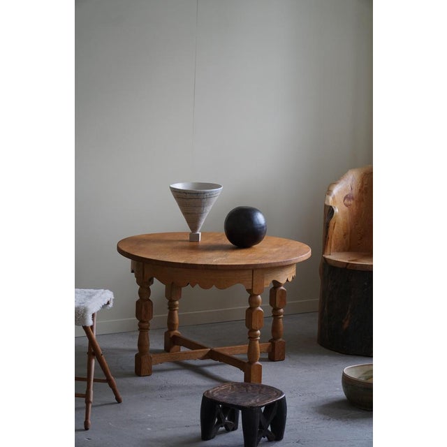 An intriguing side table in solid oak made in the 1960s by a Danish Cabinetmaker. Attributed to Danish architect Henning...