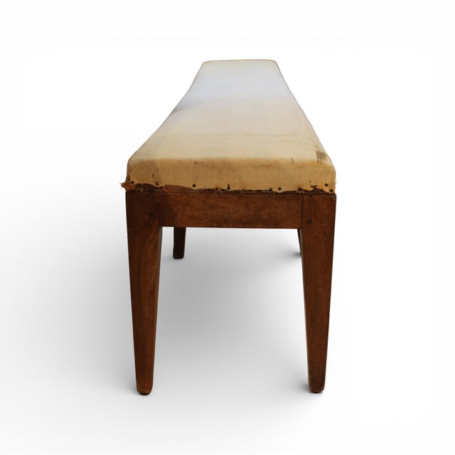 A beautifully restrained 18th-century French walnut bench from the Directoire period, exemplifying the movement’s emphasis...