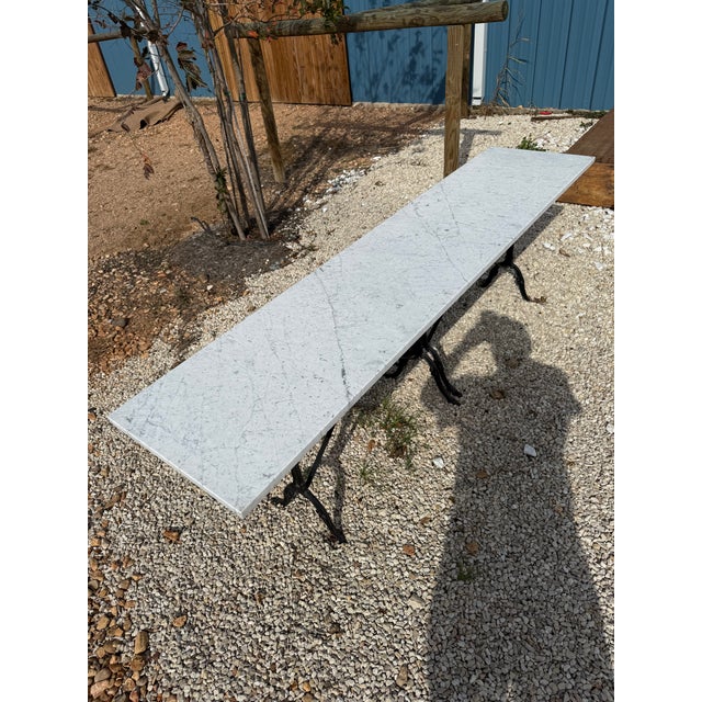long French Art Deco bistro table or dining table featuring a longe rectangular shape Carrara marble top. The Italian...
