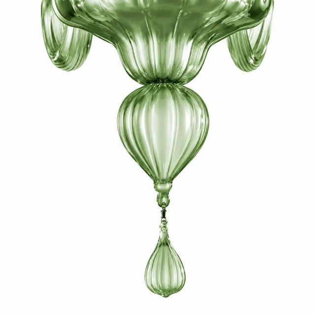 Contemporary lively chandelier in green murano glass. pop murano glass chandelier in deco style decorated in lively stin...