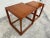 Pair of Kai Kristiansen nesting tables, fine wood joinery, solid teak. Dimensions: Large Table: 15”w x 15”d x 16.25”h...