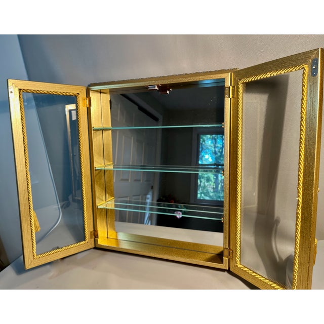 A stunning vitrine curio cabinet made by Creazioni Artistiche of Italy for the Horchow Collection. An intriguing Rococo...