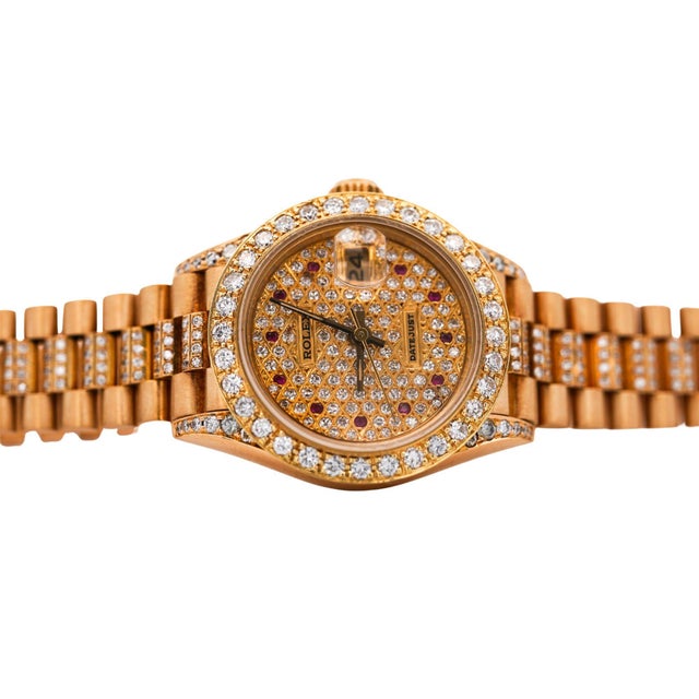Vintage 1988 Rolex Datejust Presidential automatic watch in 18K yellow gold featuring a fully paved diamond and ruby dial,...