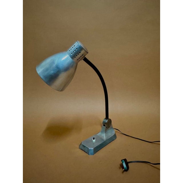 Fully restored early 20th-century aluminum lamp, beautifully crafted, slides forward and backward. To be identified....