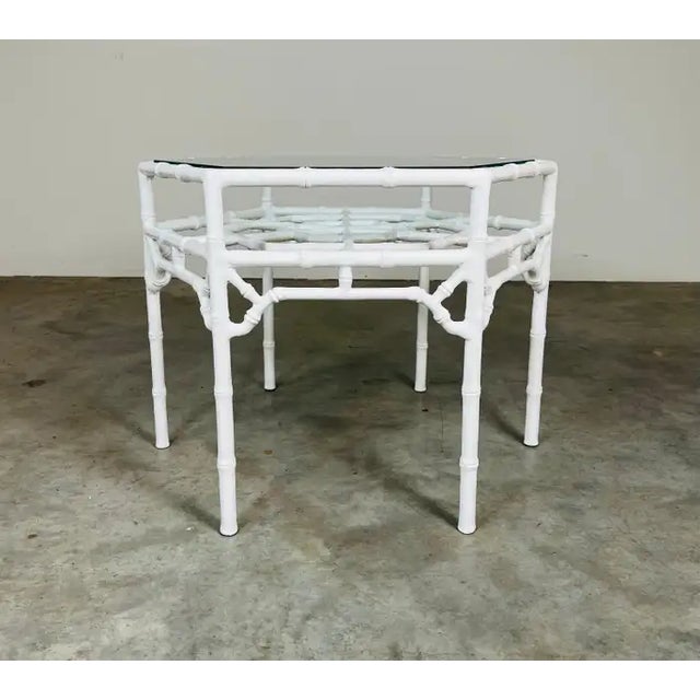 A rare and beautiful Chinese Chippendale style cocktail or center table having solid iron base in white lacquer underneath...