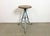 Vintage Industrial factory stool made in former Czechoslovakia during the 1960s It features a wooden seat and a light...