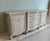 Beautiful 19th century French Country carved sideboard credenza, features a beautiful soft gray patina with off-white...
