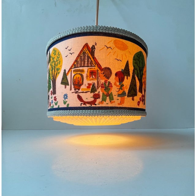 A charming 1970s Ceiling lamp for your Childs room. It features a hand-painted textile panel with Grimm's Hansel and...