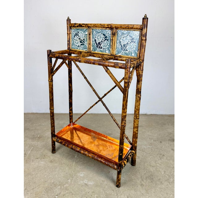 A gorgeous 1890’s antique Victorian umbrella / cane stand with scorched bamboo, ceramic decorative tile, and new solid...