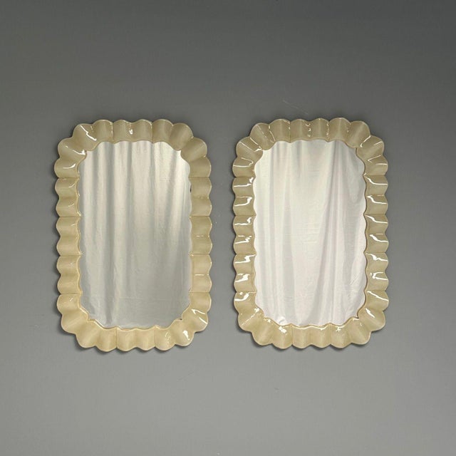 Contemporary, Wall Mirrors with Ruffle Motif, White Murano Glass, Brass, Italy, 21st c. Pair of rectangular wall mirrors...