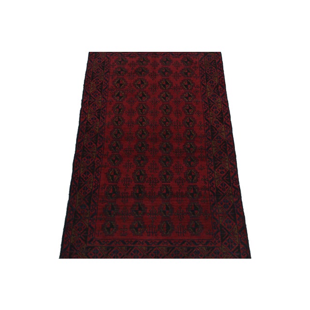 Hand knotted in wool, this 3x6 Baluch runner rug represents a new line of tribal carpets in the Modern Classics Collection...