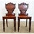 Stunning pair of Regency hall chairs from England. Dramatic in color alone, the solid mahogany planks lend themselves well...