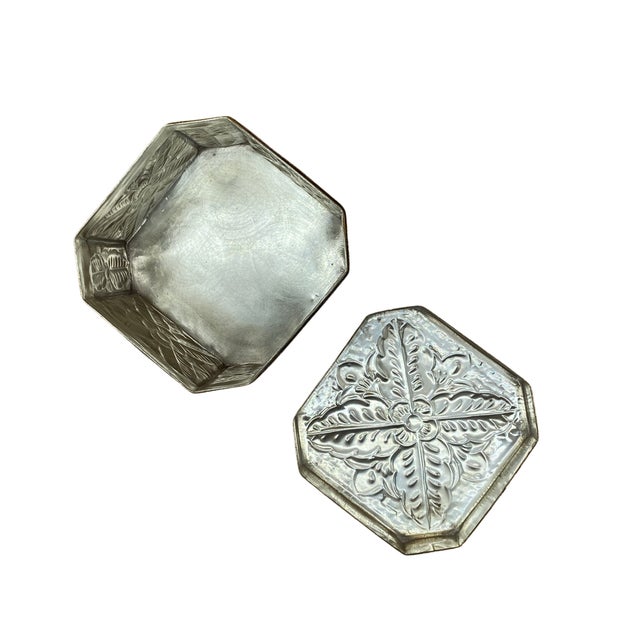 This vintage Indian trinket box presents a refined yet tactile example of mid-century export metalwork, distinguished by...