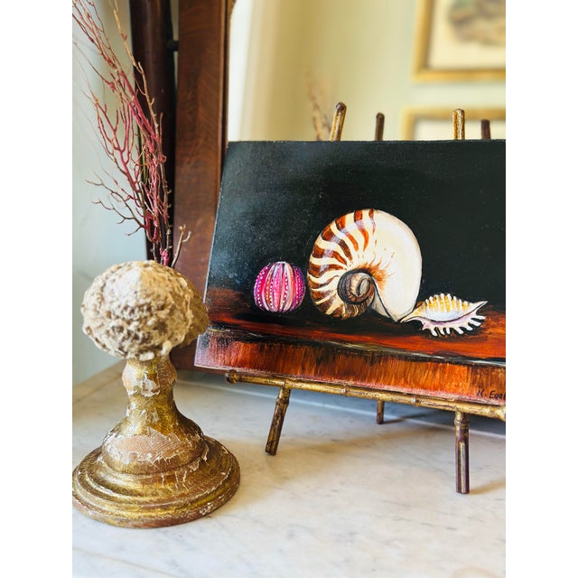 This is a one-of-a-kind coastal sculptural object created from natural marine elements and mounted on a weathered, gilded...