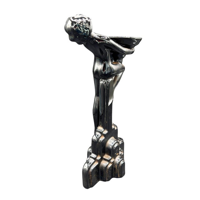 Nude Art Deco ceramic Flapper girl candleholder featuring a nude woman holding a bowl with her head thrown back, standing...