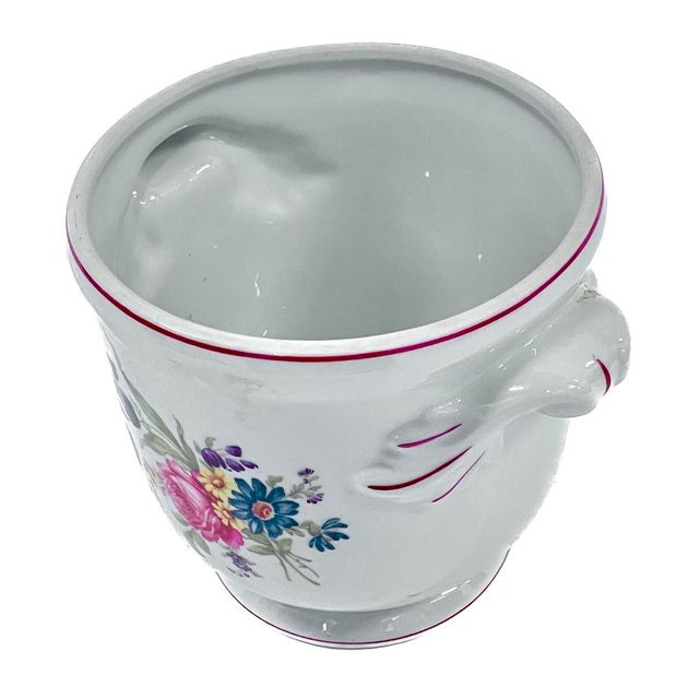 Vintage Portuguese porcelain floral cachepot with handles. Hand-painted floral arrangements on front and back with magenta...