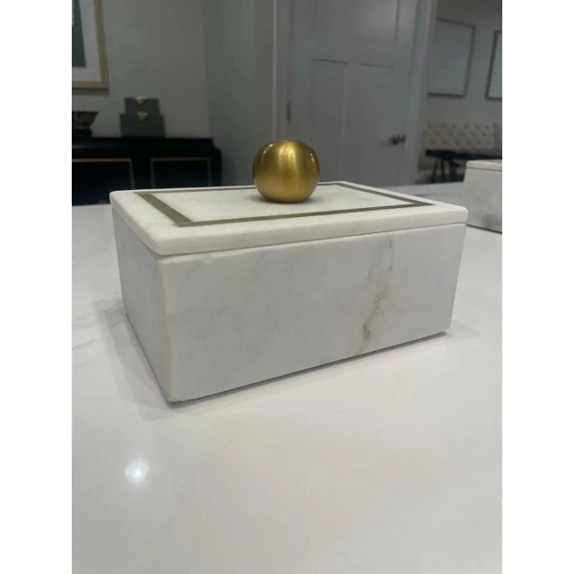 Offered is a white marble trinket box with gold details. Versatile size to use in any space in your home.