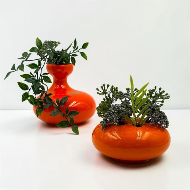 Striking pair of sculptural ceramic vases produced in Italy during the 1970s. Defined by bold rounded volumes and a vivid...