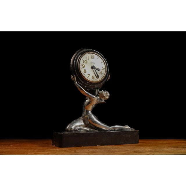 c. 1930s; Sessions Clock Co. - Forestville, CT Chrome and wood mantle clock featuring a figural woman, likely Columbia who...