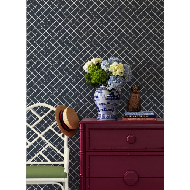 A sample of Bahama Court Navy Blue Wallpaper Care Instructions: Wipe with damp cloth.