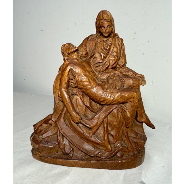 Up for sale is a wonderful antique hand carved religious Folk Art sculpture of the Pieta. It's carved with a lovely...
