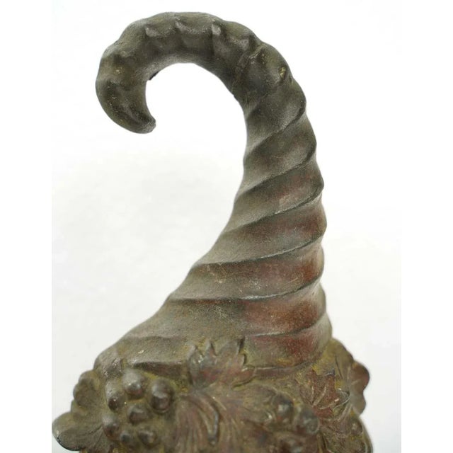 Black cast iron figural statue of a gnome. Good condition with appropriate wear from age. One available. The manufacturer...