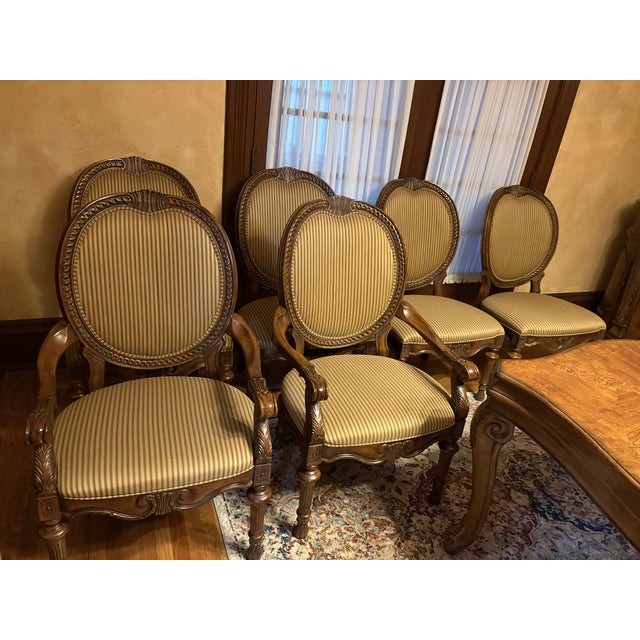Beautiful set of dining room chairs. Intricate wood work combine with a classic custom Drexel fabric make for the start of...
