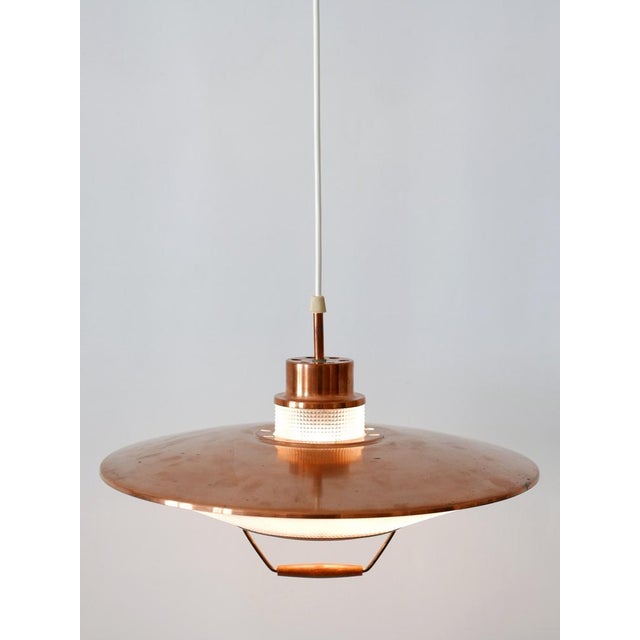 Rare and highly decorative Mid-Century Modern pendant lamp or hanging light. Designed & manufactured in 1960s in...