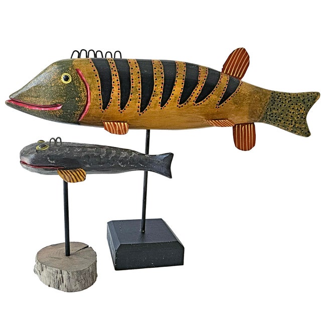Elevate your space with this striking, whimsical pair of contemporary American folk art fish sculptures by celebrated...