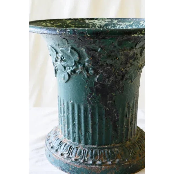 IRON JASMIN VASE - vase jasmin en fonte This heavy urn served as a planter to rotating plants on an outdoor table. Date:...