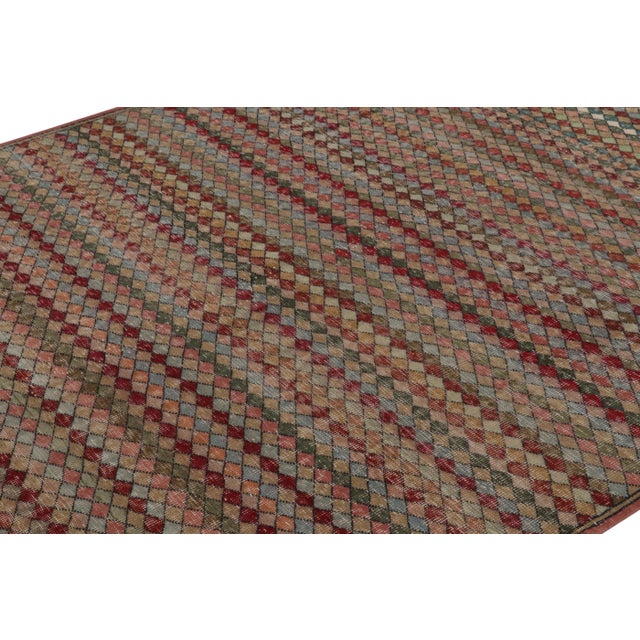 This vintage rug is a 6x7 Turkish distressed piece, made with hand-knotted wool circa mid-20th century. It is an exciting...