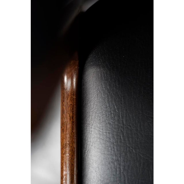 This modern Fire executive chair was produced during the 1960s. The teak frame captivates with its deep color and natural,...