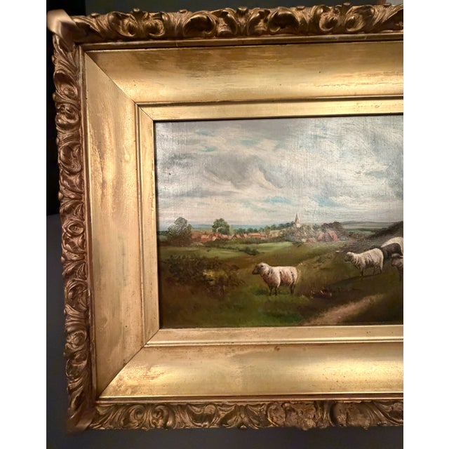 A charming late 19th century English country landscape painting, circa 1890, depicting a peaceful rural scene with a herd...