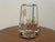 Decorative acrylic vase featuring butterflies and ornamental botanical elements encased within the clear body. The...