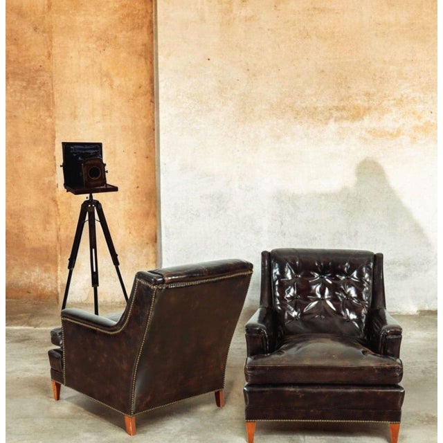A Pair of Very Rare Vintage Henredon Leather Club Chairs (Circa 1960) Bring the commanding presence of mid-century luxury...