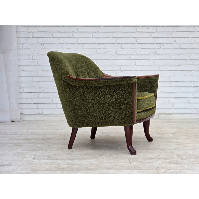 1970s, Scandinavian vintage 3-seater sofa. Original green furniture fabric, teak wood legs and armrests. Springs in the...