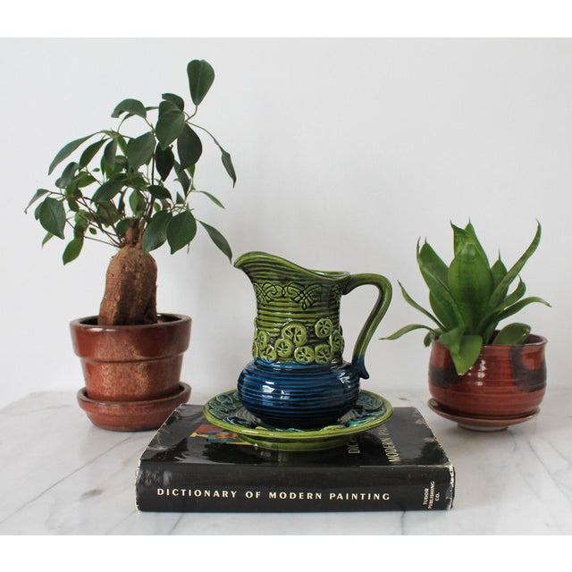Vintage Inarco blue and green glazed ceramic pottery pitcher with a matching underplate, from the mid-century modern era....