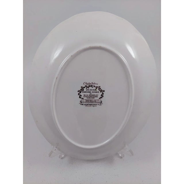 Add classic English transferware elegance to your collection with this vintage W.H. Grindley oval serving platter in the...