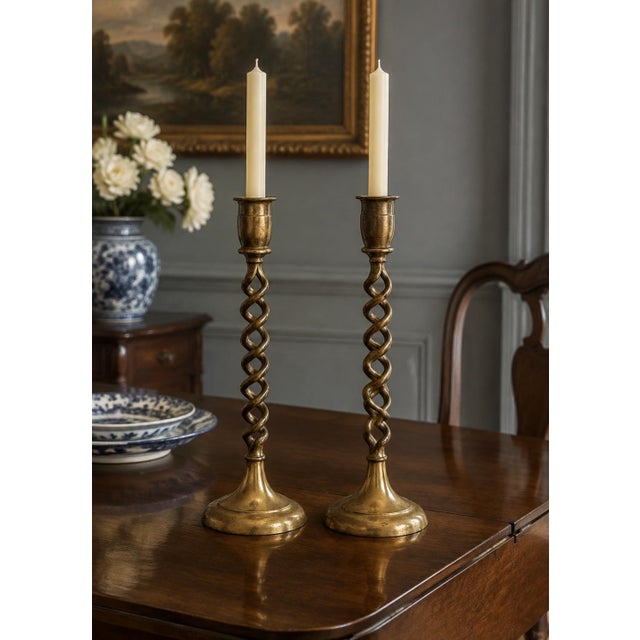A very handsome pair of vintage antique brass barley twist candle holders measuring 14 inches high with a 4 1/4 bass. Very...