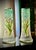 A refined pair of Art Nouveau satin glass vases attributed to Legras & Cie., featuring hand-painted and enamelled lily of...