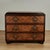 Handsome mid century chest with three drawers handcrafted in exotic crosscut rosewood featuring polished coconut mosaics...