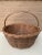 A beautifully woven early 20th century American splint oak basket with warm honeyed tones and a tightly constructed...
