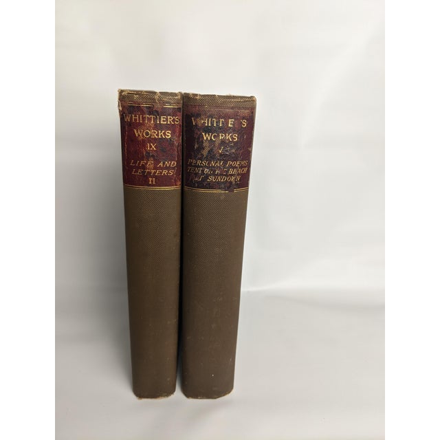 A handsome pair of late 19th-century antique literary volumes from the collected works of celebrated American poet John...