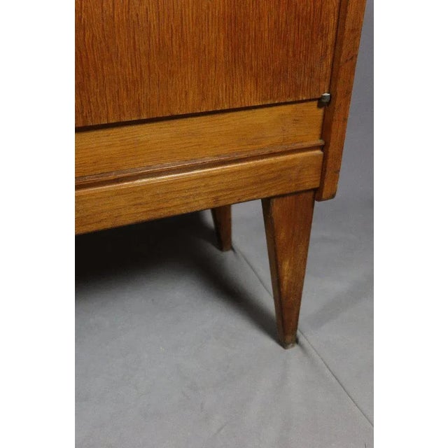 "Vintage oak buffet" vintage oak buffet from the 1950s and 1960s opening by three doors. The tray has some spots. (See...