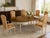 This charming French Provincial extension table features a warm, dark-stained wood top beautifully contrasted by a cream-...