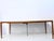 Rectangular dining table with two extension leaves from the 1960s, designed by H.W. Klein for Bramin. Teak, veneered and...