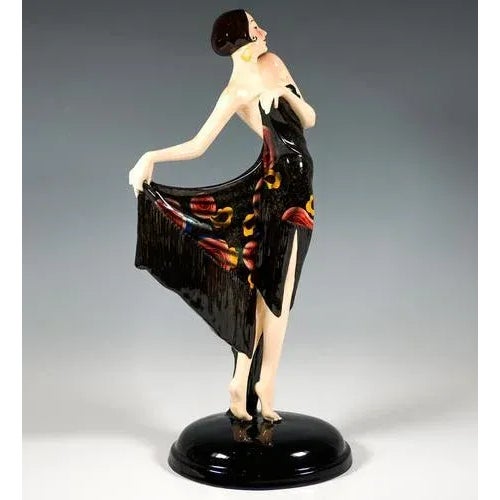 Rare and delicate goldscheider art deco ceramic figure around 1930: depiction of an elegant, pretty dancer with dark,...